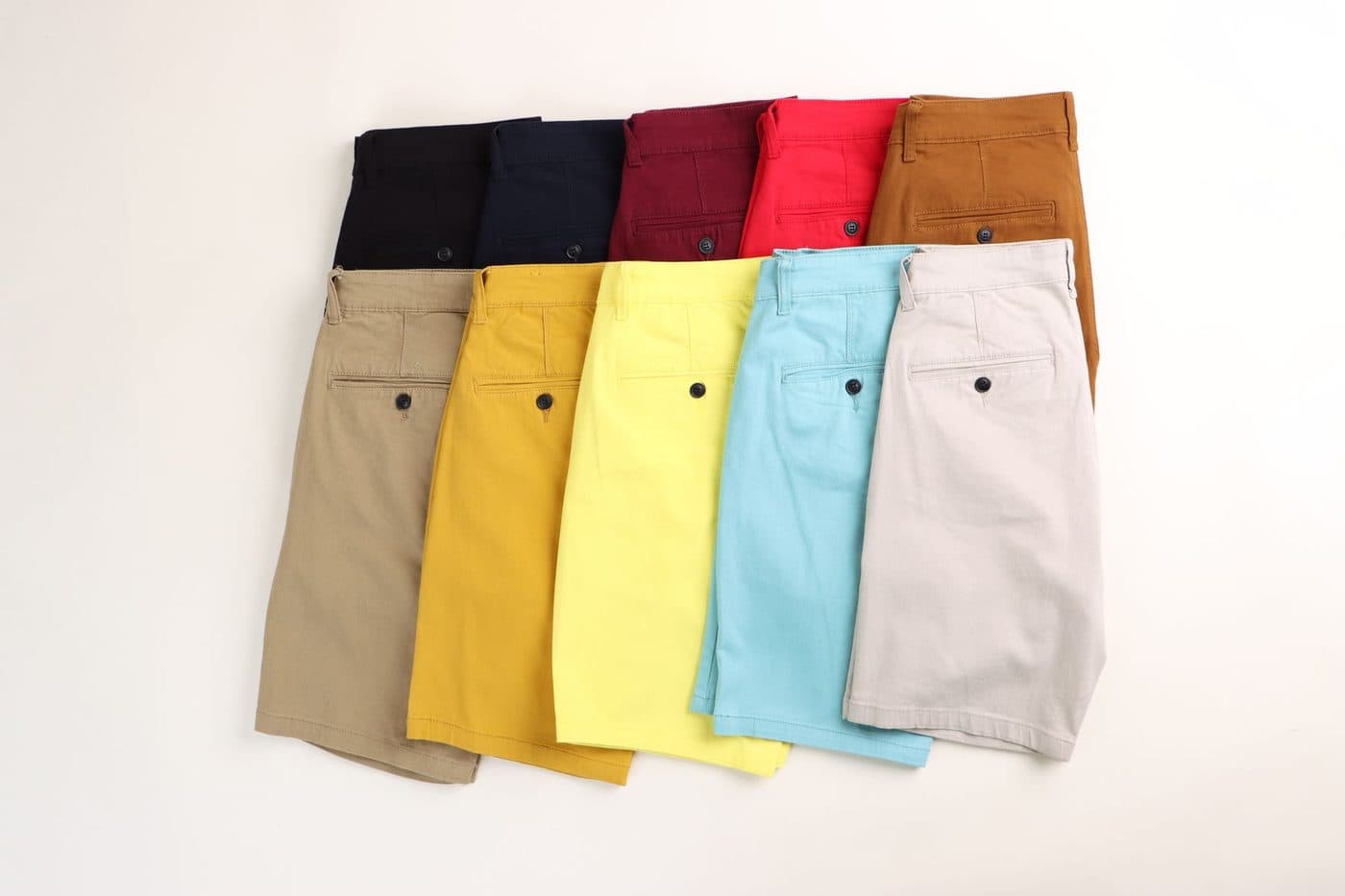 Flat lay of plain chino shorts in assorted colours