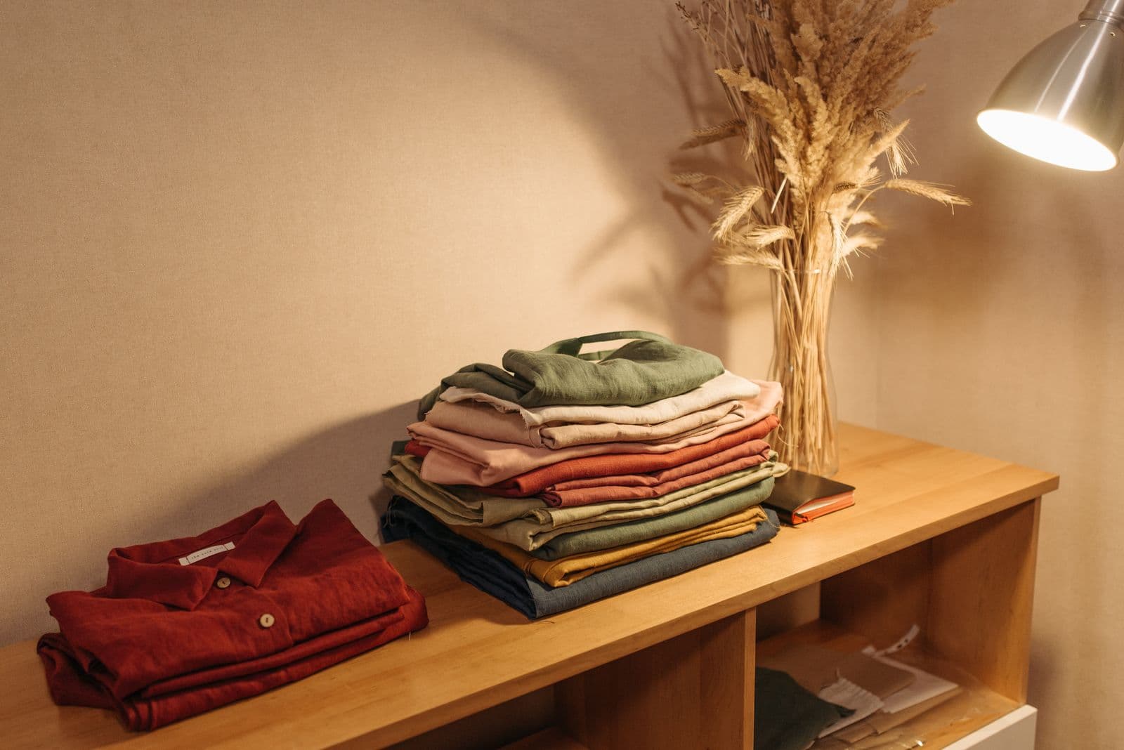 Folded men's shirts stacked on a shelf